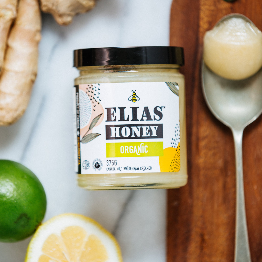 Elias Honey Organic Jar, a spoonful of honey, ginger, lemon and lime